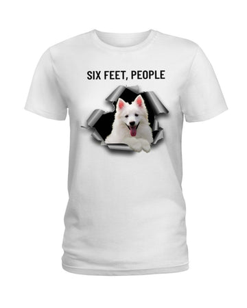 American Eskimo Dog six feet people white t-shirt